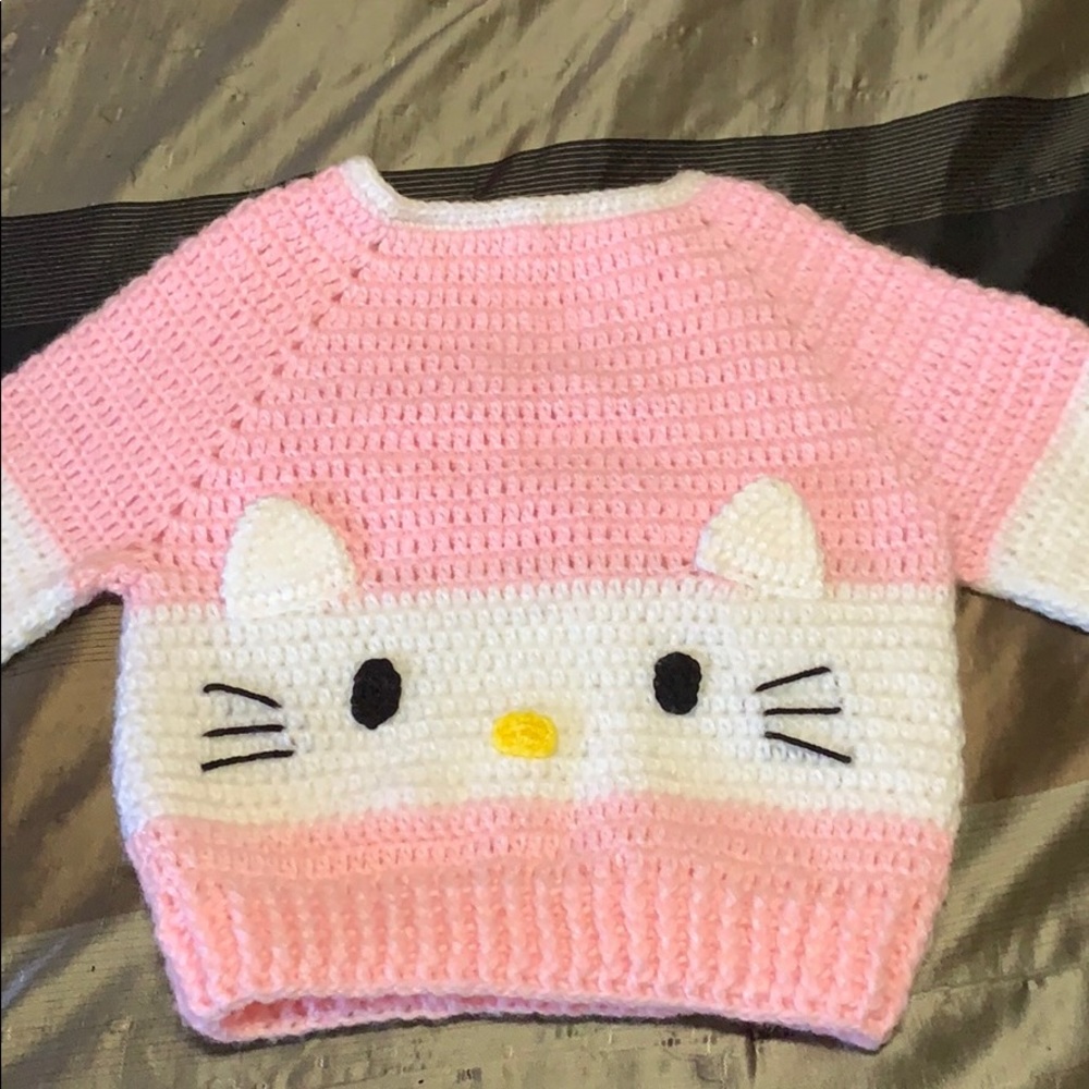 White and pink sweater